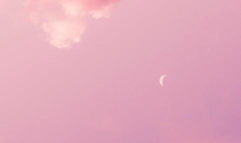 Soft pink sky during the new moon phase, creating a serene and peaceful atmosphere perfect for reflection and manifesting new beginnings.